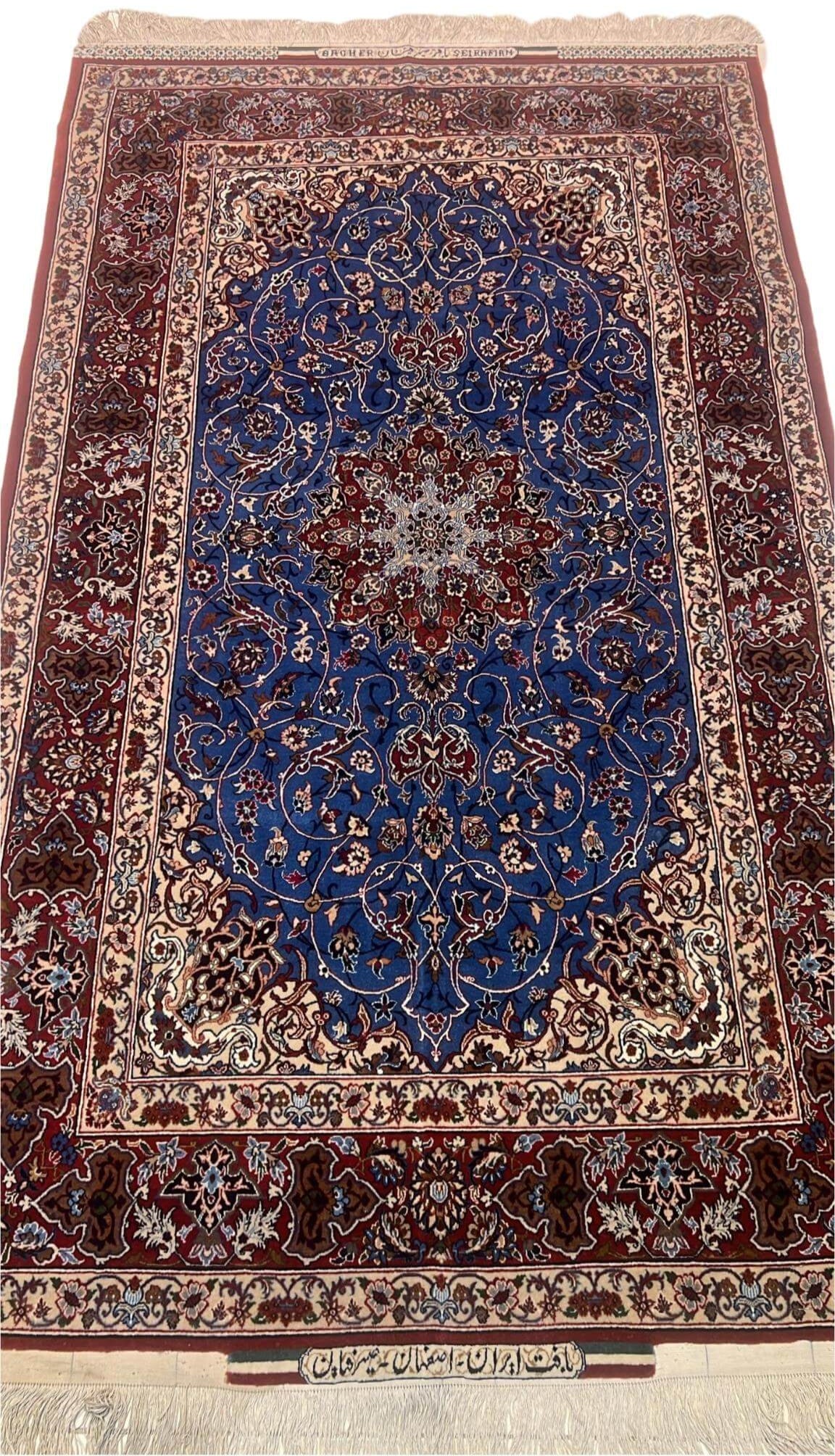 Front View: Elegant hand-knotted Persian rug in blue and red tones by Master Bagher Seirafian.